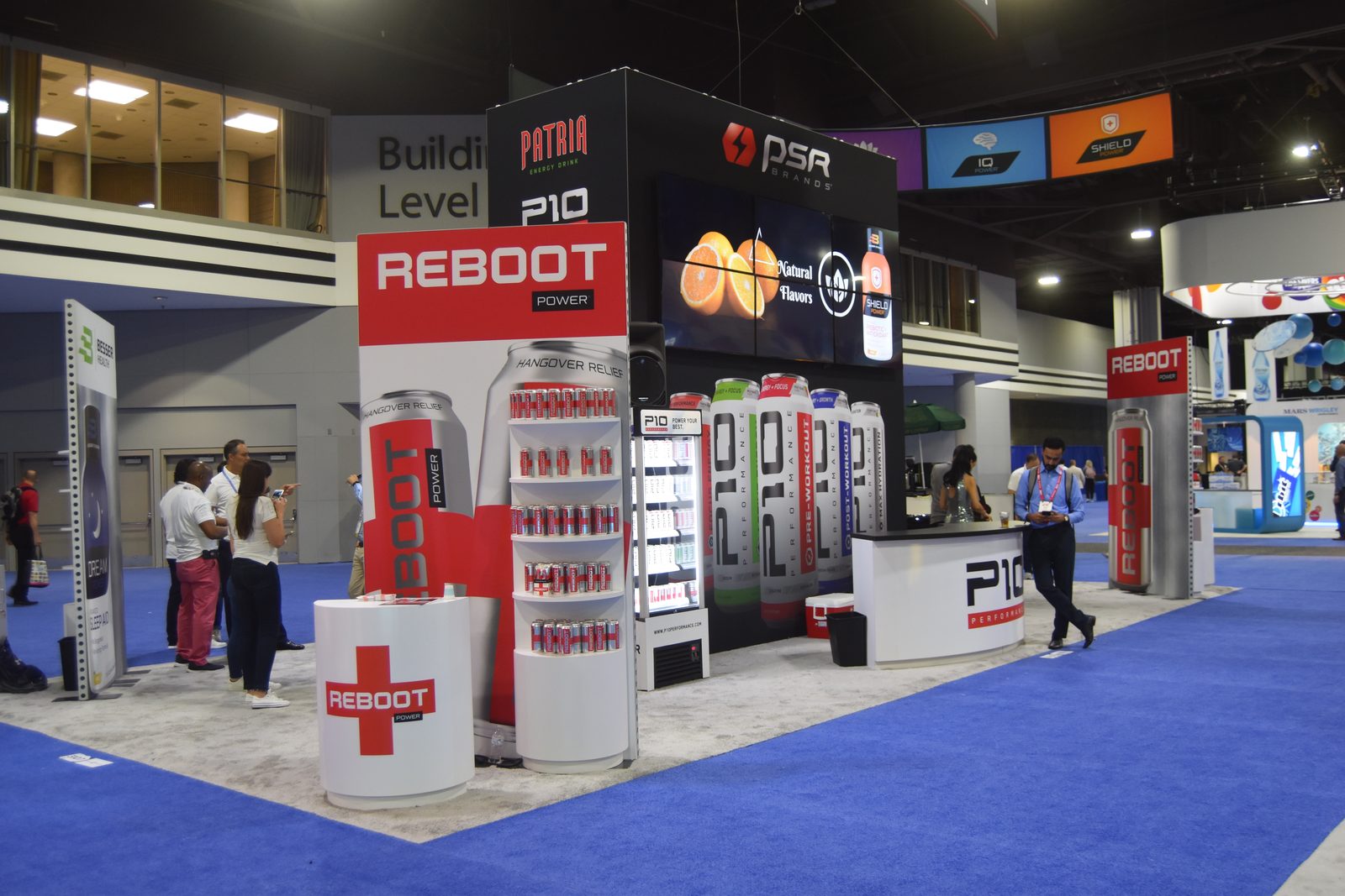 Beverage brand exhibit with product displays, built by DSM Exhibits